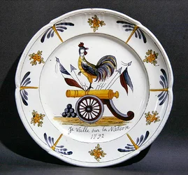 Nevers plate depicting a cockerel on a cannon