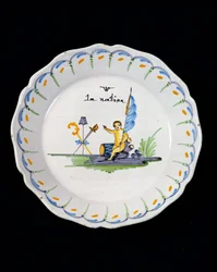 Plate decorated with a genie sitting on a drum, and the Three Orders of The Nation
