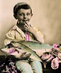 Portrait of a boy holding a fish c.1898