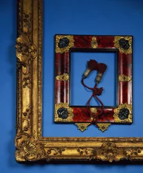 Regency reverse profile frame with ormolu and embossed silver mounts to the corners and centres with the original tassels (tortoiseshell)