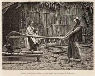 The rice mill, in front of a farmer