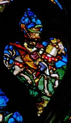 The west rose window depicting a scene from the Book of Revelation: Abaddon or Apollyon, the angel of the bottomless pit