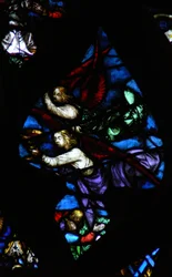 The west rose window depicting a scene from the Book of Revelation: Two angels, one announcing Babylon is fallen, the other carrying the wine of the wrath of God