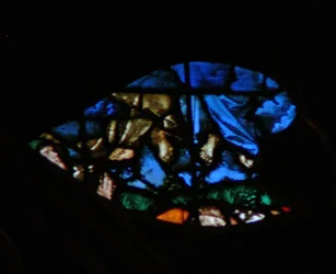 The west rose window depicting a scene from the Book of Revelation: Resurrection of the witnesses and their ascension whilst the lookers on are amazed