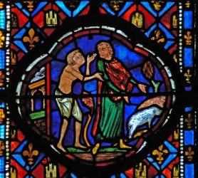 Window Ew-L depicting a scene from the Prodigal Son story: having spent all his money he looks after pigs and reflects on his situation