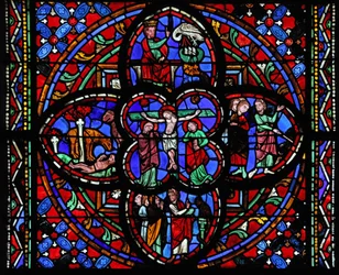 Window depicting the third section with the Crucifixion: also Moses strikes the rock at Horeb; the brazen serpent; a lion revives its young; David and the Pelican