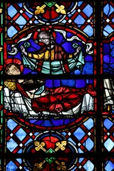 Window depicting the Charity of St Martin: he divides his cloak and this is returned by Christ