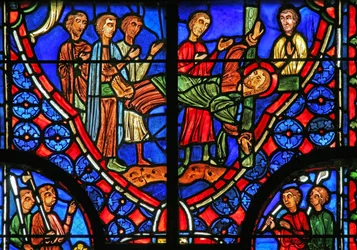 Window w11 depicting St Andrew bound to his cross and preaches to the crowd