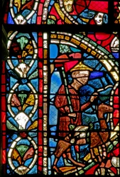 Window depicting a scene from the Prodigal Son story: departs