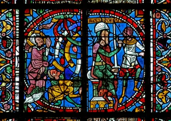 Window w125 depicting a scene from the life of St Catherine: Maxence orders her to be broken on the wheel