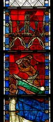 Window w15 depicting a scene from a legend of St Nicholas: the miracle of 3 boys: a butcher kills three boys