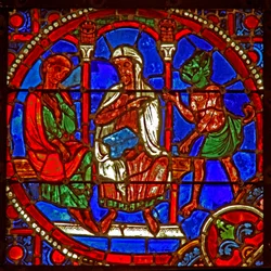 Window depicting a scene from the Theophilus story: he is introduced to Satan by a magician