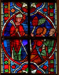 Window depicting a scene from a legend of St Nicholas: he confronts some thieves