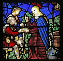 Window depicting St Genevieve gives a leper drink