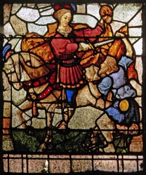 Window depicting the Charity of St Martin: he divides his cloak