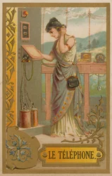 Woman using a very early telephone