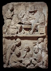 Stele representing a scene of meals and children