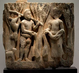 Exchange clothes with a hunter. Low relief sculpted, art of Gandhara (Pakistan), 2nd-3rd century. National Museum of Korea, Seoul (South Korea)