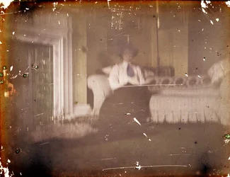 Woman sitting on a Sofa