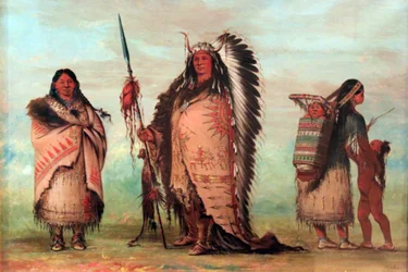 Black Rock with family. The chief proudly presents his emblems of honor, including a lance with scalp