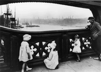 People watching the Thames from Tower Bridge, City of London