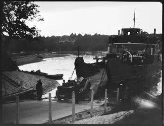 A car driving off the slipway onto the Isle of Wight Ferry