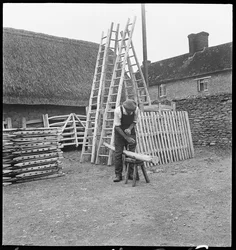 A man making a willow ladder in Aston