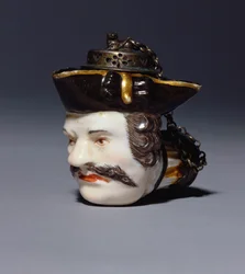 A Meissen portrait pipe-bowl modelled as the head of Schmiedel, c.1750