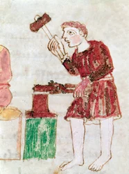 The blacksmith beating iron on a miniature anvil from the manuscript 