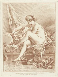 Naked Woman Sitting on Bed with Flowers