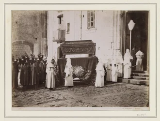 Funeral Procession of Monks with Pointed Hoods at the Entrance of a Church in Italy