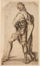 A man standing, seen from behind