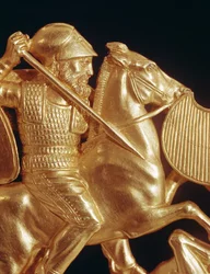 Comb ornamented with warrior in combat