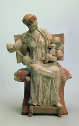 Figurine of Aphrodite playing with Eros, from Tanagra, late 4th century BC