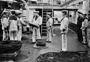At drill with a 6 inch quick firing gun on board the battleship HMS Resolution, 1896