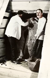 Howard Carter and a colleague excavating a tomb in the Valley of the Kings, Egypt
