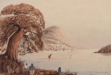 View of a coastal city with tree and figures in the foreground