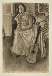 Seated Model with a Guitar