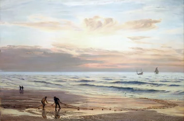 Fishermen pulling their nets on the shores of the north coast of Wales