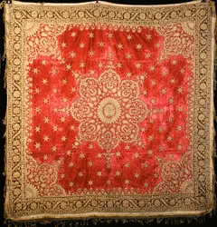A Scarlet Velvet Floor Cover with Green Velvet Border, Densely Embroidered in Gilt Couched Gilt Thread
