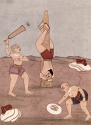 Acrobats performing physical feats