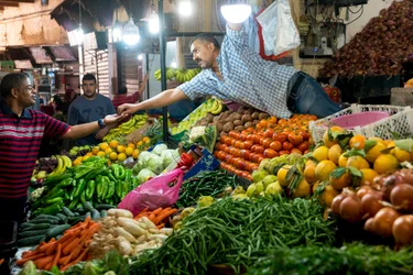 A vendor in a souk in Fes, Morocco (photo)