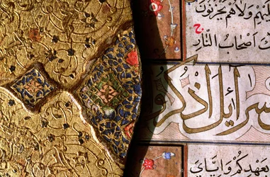 Detail of the intricate gold and lapis lazuli illuminations and arabesque designs with thuluth and naskh scripts on a Koran cover