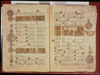 Seljuk style Koran with coloured inscriptions and decorative counting medallions in the margins, 12-13th century