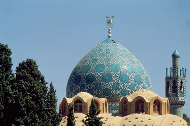 Turquoise tiled dome of the Mausoleum of Shah Nematollah Vali