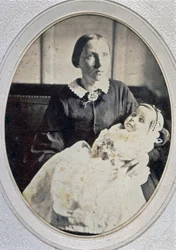 Post mortem portrait of a little girl held by her mother, c. 1855