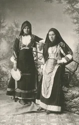 Two women wearing traditional clothes from Belvi and Aritzo, Sardinia, Italy, circa 1910