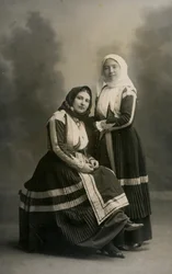 Two women wearing traditional costumes, Fonni, Sardinia, Italy, circa 1915