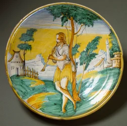 Flute player in a landscape. Ceramic plate produced in Viterbo, Italy. End of the 16th century, Florence, Museo Nazionale del Bargello