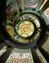 View of the stone spiral staircase looking up towards the ceiling, designed by Jacopo Vignola and his successors